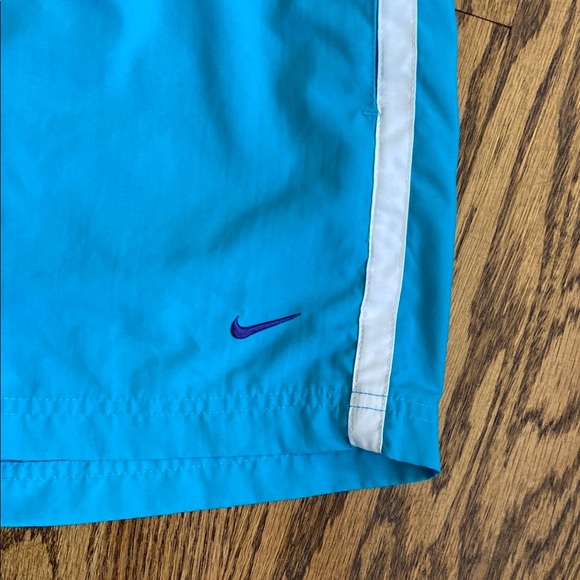 Bright turquoise with white side stripe Nike shorts with pockets, size women’s L - Picture 2 of 16